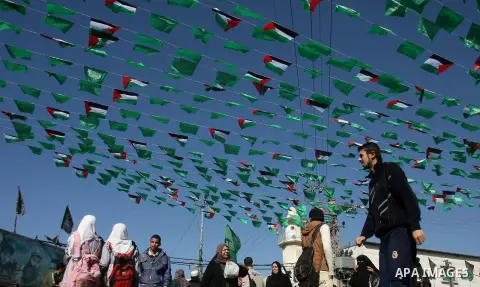 Palestinians gather during the funeral Mahmoud Jarghoun, 21, during his funeral in the town of Rafah in the southern Gaza Strip on December 1, 2012. One Palestinian died and another was wounded when an Israeli missile fi...