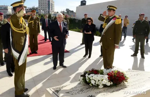 Palestinian President Mahmoud Abbas lays a wreath on the former Palestinian leader Yasser Arafat's mausoleum, following arrives to the West Bank city of Ramallah on December 2, 2012. Abbas arrived to the West Bank after...