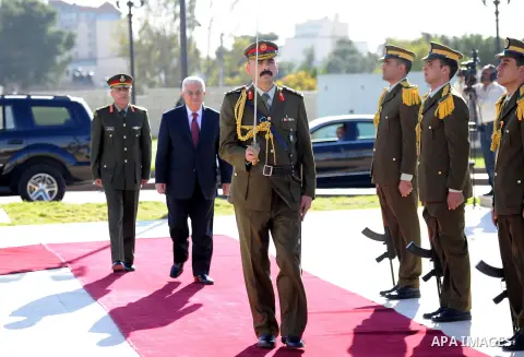 Palestinian President Mahmoud Abbas is greated by honor guards as he arrives to the West Bank city of Ramallah on December 2, 2012. Abbas arrived to the West Bank after a vote on a resolution to upgrade the status of the...