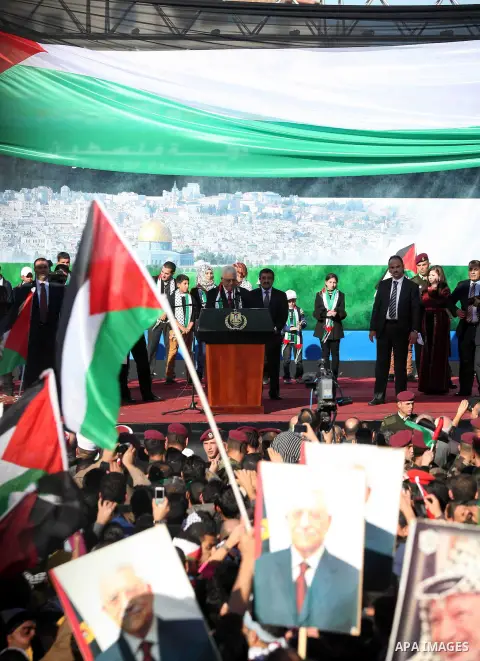 Palestinian President Mahmoud Abbas speaks as Palestinians celebrate their successful bid for UN non-member observer state status, in the West Bank city of Ramallah on December 2, 2012, Abbas arrived to the West Bank aft...