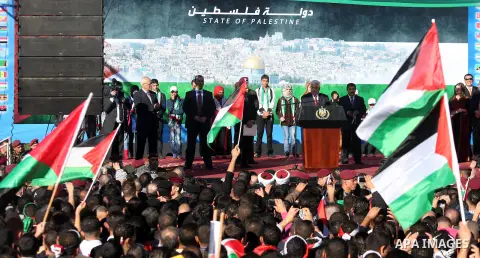 Palestinian President Mahmoud Abbas speaks as Palestinians celebrate their successful bid for UN non-member observer state status, in the West Bank city of Ramallah on December 2, 2012, Abbas arrived to the West Bank aft...