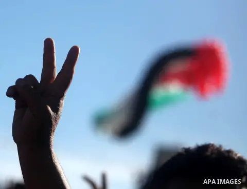 A huge Palestinian flag made out of balloons is made ready to fly as Palestinians celebrate their successful bid for UN non-member observer state status, in the West Bank city of Ramallah on December 2, 2012, Abbas arriv...