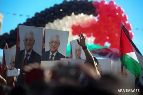 Palestinians wave national flags as they celebrate their successful bid for UN non-member observer state status, in the West Bank city of Ramallah on December 2, 2012, Palestinian President Mahmoud Abbas arrived to the W...