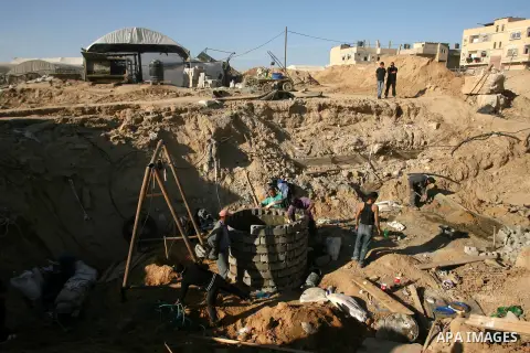 Palestinian labourers repair a bombed smuggling tunnel linking the Gaza Strip to Egypt, in Rafah, on December 2, 2012. Israeli airforce jets bombed most of the smuggling tunnels in the southern Gaza Strip during its war...