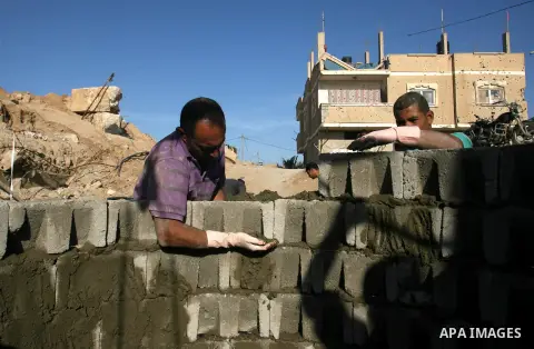 Palestinian labourers repair a bombed smuggling tunnel linking the Gaza Strip to Egypt, in Rafah, on December 2, 2012. Israeli airforce jets bombed most of the smuggling tunnels in the southern Gaza Strip during its war...
