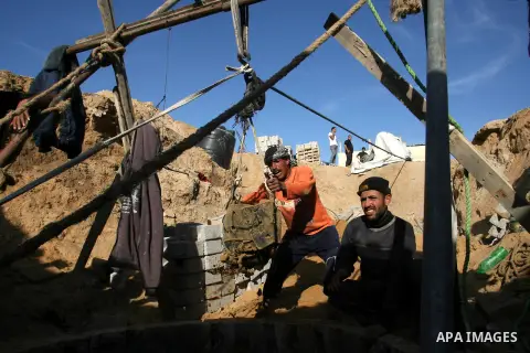 Palestinian labourers repair a bombed smuggling tunnel linking the Gaza Strip to Egypt, in Rafah, on December 2, 2012. Israeli airforce jets bombed most of the smuggling tunnels in the southern Gaza Strip during its war...