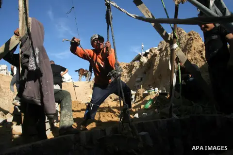 Palestinian labourers repair a bombed smuggling tunnel linking the Gaza Strip to Egypt, in Rafah, on December 2, 2012. Israeli airforce jets bombed most of the smuggling tunnels in the southern Gaza Strip during its war...