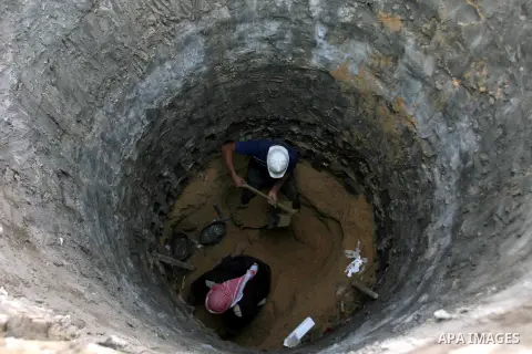 Palestinian labourers repair a bombed smuggling tunnel linking the Gaza Strip to Egypt, in Rafah, on December 2, 2012. Israeli airforce jets bombed most of the smuggling tunnels in the southern Gaza Strip during its war...