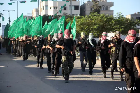 Palestinian members of al-Qassam brigades, the armed wing of the Hamas movement, take part in an anti-Israel parade in Gaza City December 2, 2012. Eight days of Israeli air strikes on Gaza and cross-border Palestinian ro...