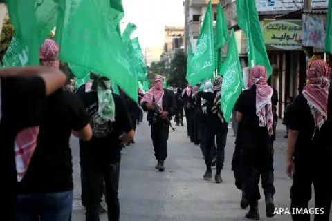 Palestinian members of al-Qassam brigades, the armed wing of the Hamas movement, take part in an anti-Israel parade in Gaza City December 2, 2012. Eight days of Israeli air strikes on Gaza and cross-border Palestinian ro...