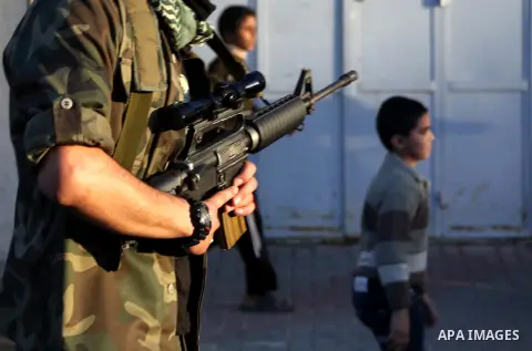 Palestinian members of al-Qassam brigades, the armed wing of the Hamas movement, take part in an anti-Israel parade in Gaza City December 2, 2012. Eight days of Israeli air strikes on Gaza and cross-border Palestinian ro...