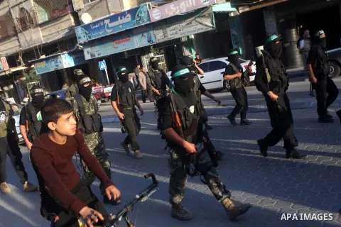 Palestinian members of al-Qassam brigades, the armed wing of the Hamas movement, take part in an anti-Israel parade in Gaza City December 2, 2012. Eight days of Israeli air strikes on Gaza and cross-border Palestinian ro...