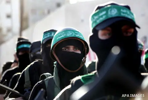 Palestinian members of al-Qassam brigades, the armed wing of the Hamas movement, take part in an anti-Israel parade in Gaza City December 2, 2012. Eight days of Israeli air strikes on Gaza and cross-border Palestinian ro...