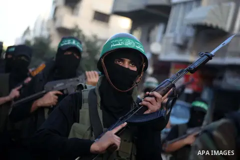 Palestinian members of al-Qassam brigades, the armed wing of the Hamas movement, take part in an anti-Israel parade in Gaza City December 2, 2012. Eight days of Israeli air strikes on Gaza and cross-border Palestinian ro...
