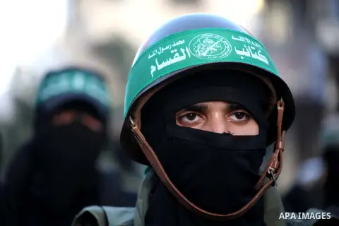 A Palestinian member of al-Qassam brigades, the armed wing of the Hamas movement, takes part in an anti-Israel parade in Gaza City December 2, 2012. Eight days of Israeli air strikes on Gaza and cross-border Palestinian...