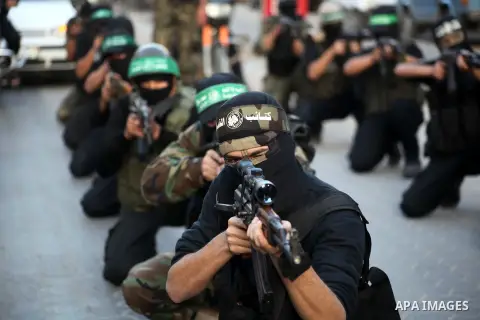 Palestinian members of al-Qassam brigades, the armed wing of the Hamas movement, take part in an anti-Israel parade in Gaza City December 2, 2012. Eight days of Israeli air strikes on Gaza and cross-border Palestinian ro...