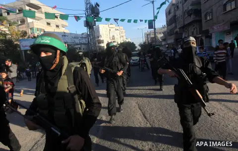 Palestinian members of al-Qassam brigades, the armed wing of the Hamas movement, take part in an anti-Israel parade in Gaza City December 2, 2012. Eight days of Israeli air strikes on Gaza and cross-border Palestinian ro...