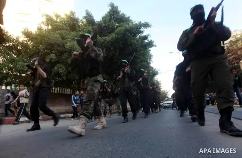 Palestinian members of al-Qassam brigades, the armed wing of the Hamas movement, take part in an anti-Israel parade in Gaza City December 2, 2012. Eight days of Israeli air strikes on Gaza and cross-border Palestinian ro...