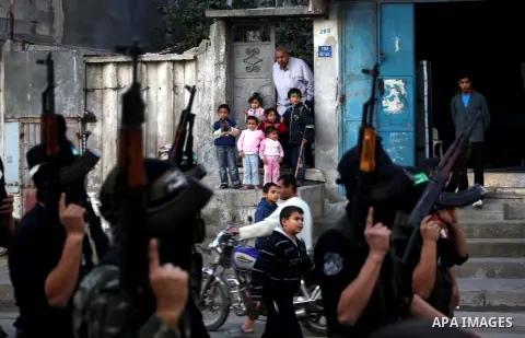 Palestinian members of al-Qassam brigades, the armed wing of the Hamas movement, take part in an anti-Israel parade in Gaza City December 2, 2012. Eight days of Israeli air strikes on Gaza and cross-border Palestinian ro...