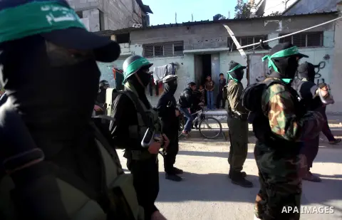 Palestinian members of al-Qassam brigades, the armed wing of the Hamas movement, take part in an anti-Israel parade in Gaza City December 2, 2012. Eight days of Israeli air strikes on Gaza and cross-border Palestinian ro...