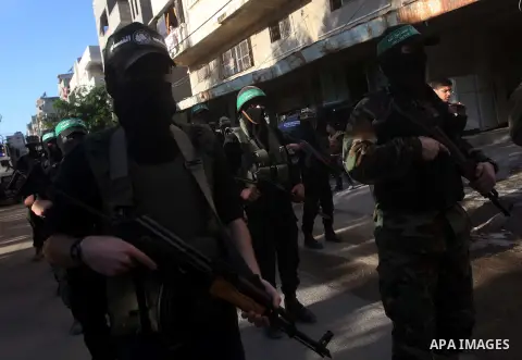 Palestinian members of al-Qassam brigades, the armed wing of the Hamas movement, take part in an anti-Israel parade in Gaza City December 2, 2012. Eight days of Israeli air strikes on Gaza and cross-border Palestinian ro...