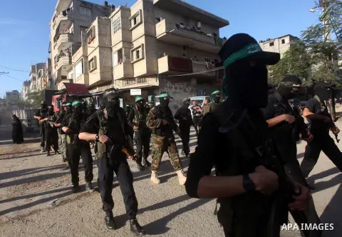 Palestinian members of al-Qassam brigades, the armed wing of the Hamas movement, take part in an anti-Israel parade in Gaza City December 2, 2012. Eight days of Israeli air strikes on Gaza and cross-border Palestinian ro...