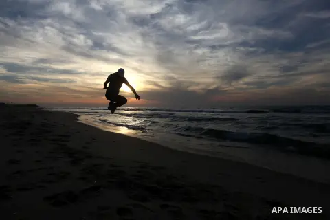 Palestinians enjoy at the beach in Gaza City on December 2, 2012. As part of the truce that ended eight days of cross-boarder fighting between Israel and Gaza militants, Israel's naval blockade of the coastal territory w...