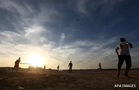 Palestinian youths play football at the beach in Gaza City on December 2, 2012. As part of the truce that ended eight days of cross-boarder fighting between Israel and Gaza militants, Israel's naval blockade of the coast...
