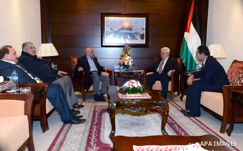 Palestinian President Mahmoud Abbas meets with the Former President of the Jordanian Bar Association, in the West Bank city of Ramallah, 04 Dec, 2012. Photo by Thaer Ganaim
