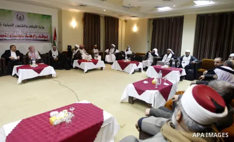 Palestinian Minister of Religious Affairs in Gaza strip Ismail Radwan meets with the members of delegation of Association of Muslim Scholars in Gaza city, Dec 04, 2012. The delegation is expected to meet with war victims...