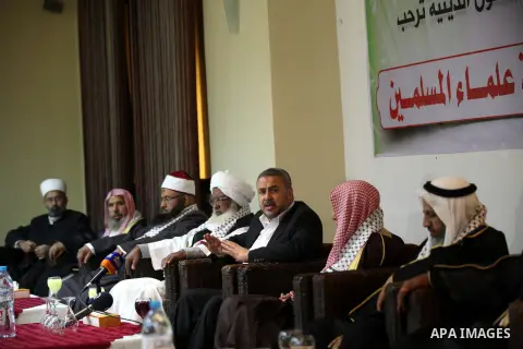 Palestinian Minister of Religious Affairs in Gaza strip Ismail Radwan (not seen) meets with the members of delegation of Association of Muslim Scholars in Gaza city, Dec 04, 2012. The delegation is expected to meet with...