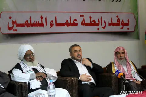 Palestinian Minister of Religious Affairs in Gaza strip Ismail Radwan (not seen) meets with the members of delegation of Association of Muslim Scholars in Gaza city, Dec 04, 2012. The delegation is expected to meet with...