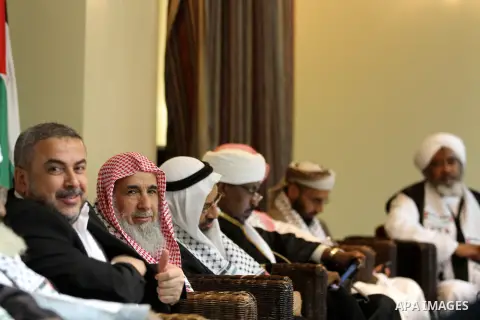 Palestinian Minister of Religious Affairs in Gaza strip Ismail Radwan (not seen) meets with the members of delegation of Association of Muslim Scholars in Gaza city, Dec 04, 2012. The delegation is expected to meet with...