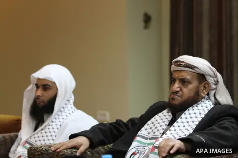 Palestinian Minister of Religious Affairs in Gaza strip Ismail Radwan (not seen) meets with the members of delegation of Association of Muslim Scholars in Gaza city, Dec 04, 2012. The delegation is expected to meet with...