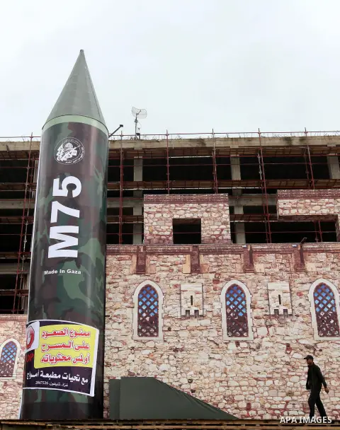 A gigantic model of a local-made M75 long range rocket is seen on stage during a preparations for Hamas rally in Gaza City December 5, 2012. Hamas armed wing said they had fired M75 rocket into Jerusalem and Tel Aviv dur...