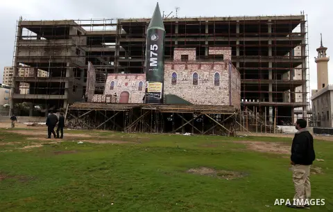 A gigantic model of a local-made M75 long range rocket is seen on stage during a preparations for Hamas rally in Gaza City December 5, 2012. Hamas armed wing said they had fired M75 rocket into Jerusalem and Tel Aviv dur...