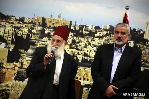Palestinian Prime Minister in Gaza Strip, Ismail Haniyeh meets with Shaykh al-Mujahideen Sheikh Hafez Salama, in Gaza city on Dec. 05, 2012. Photo by Ashraf Amra