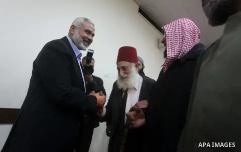 Palestinian Prime Minister in Gaza Strip, Ismail Haniyeh meets with Shaykh al-Mujahideen Sheikh Hafez Salama, in Gaza city on Dec. 05, 2012. Photo by Ashraf Amra