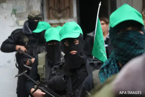 Palestinian members of al-Qassam brigades, the armed wing of the Hamas movement, take part in an anti-Israel parade in Gaza City December 5, 2012. Eight days of Israeli air strikes on Gaza and cross-border Palestinian ro...
