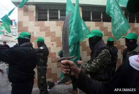 Palestinian members of al-Qassam brigades, the armed wing of the Hamas movement, take part in an anti-Israel parade in Gaza City December 5, 2012. Eight days of Israeli air strikes on Gaza and cross-border Palestinian ro...