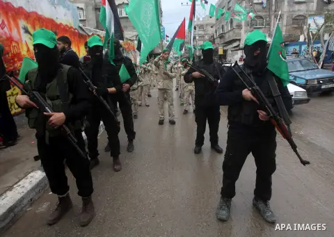 Palestinian members of al-Qassam brigades, the armed wing of the Hamas movement, take part in an anti-Israel parade in Gaza City December 5, 2012. Eight days of Israeli air strikes on Gaza and cross-border Palestinian ro...