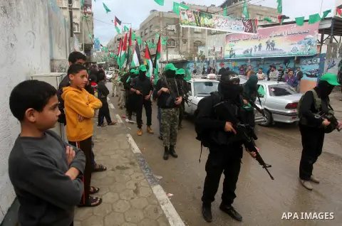 Palestinian members of al-Qassam brigades, the armed wing of the Hamas movement, take part in an anti-Israel parade in Gaza City December 5, 2012. Eight days of Israeli air strikes on Gaza and cross-border Palestinian ro...