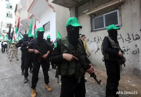 Palestinian members of al-Qassam brigades, the armed wing of the Hamas movement, take part in an anti-Israel parade in Gaza City December 5, 2012. Eight days of Israeli air strikes on Gaza and cross-border Palestinian ro...