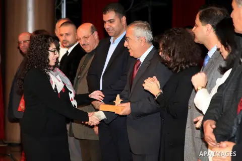 Palestinian Prime Minister Salam Fayyad, attends the national festival for honoring the Palestinian volunteers ?Ounah?, in the West Bank city of Ramallah, on 05 December 2012. Photo by Mustafa Abu Dayeh