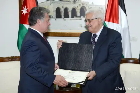 Palestinian President Mahmoud Abbas meets with Jordan's King Abdullah II during their meeting in the West Bank city of Ramallah on December 6, 2012. The Jordanian King arrived in Ramallah for the first visit by a top for...
