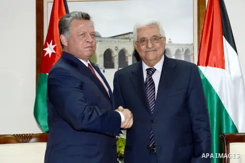 Palestinian President Mahmoud Abbas shakes hands with Jordan's King Abdullah II during their meeting in the West Bank city of Ramallah on December 6, 2012. The Jordanian King arrived in Ramallah for the first visit by a...