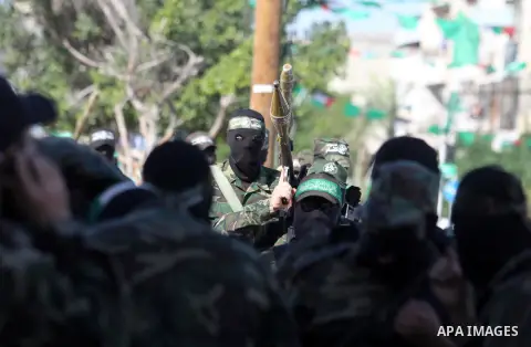 Palestinian militants of the Ezzedine al-Qassam brigade, the armed wing Hamas, attend Friday prayer as they prepare for the arrival of the Islamist movement's exiled politburo chief Khaled Meshaal who is due in the Gaza...