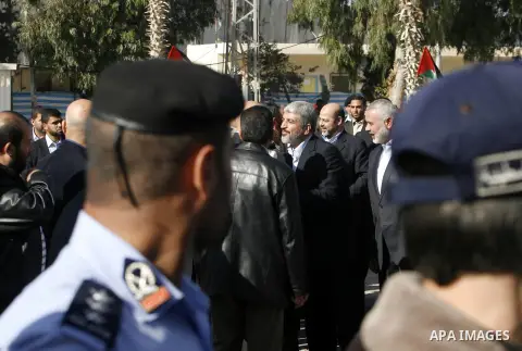 Hamas chief Khaled Meshaal and Palestinian prime minister in the Gaza Strip, Ismail Haniya walk upon Meshaal's arrival in Rafah, southern Gaza, on December 7, 2012. Meshaal is making his first-ever visit to the Gaza Stri...