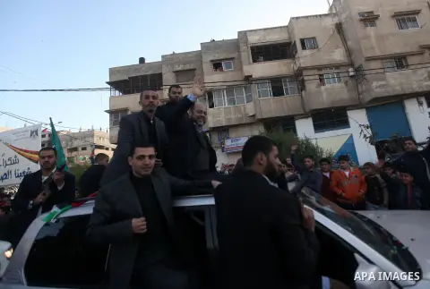 Hamas leader Mousa Abu Marzoup waves to the crowd upon his arrival in Gaza City December 7, 2012. Meshaal is making his first-ever visit to the Gaza Strip amid tight security for festivities marking the ruling Islamist m...