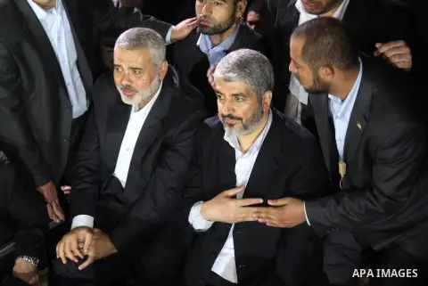 Hamas leader Khaled Meshaal visits the home of the al-Dallu family, which destroyed by an Israeli airstrike on November 24 and several members of the al-Dallu family - five of them children - and two of their neighbours...